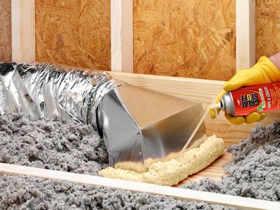 Sealing ductwork with spray foam insulation in a home attic