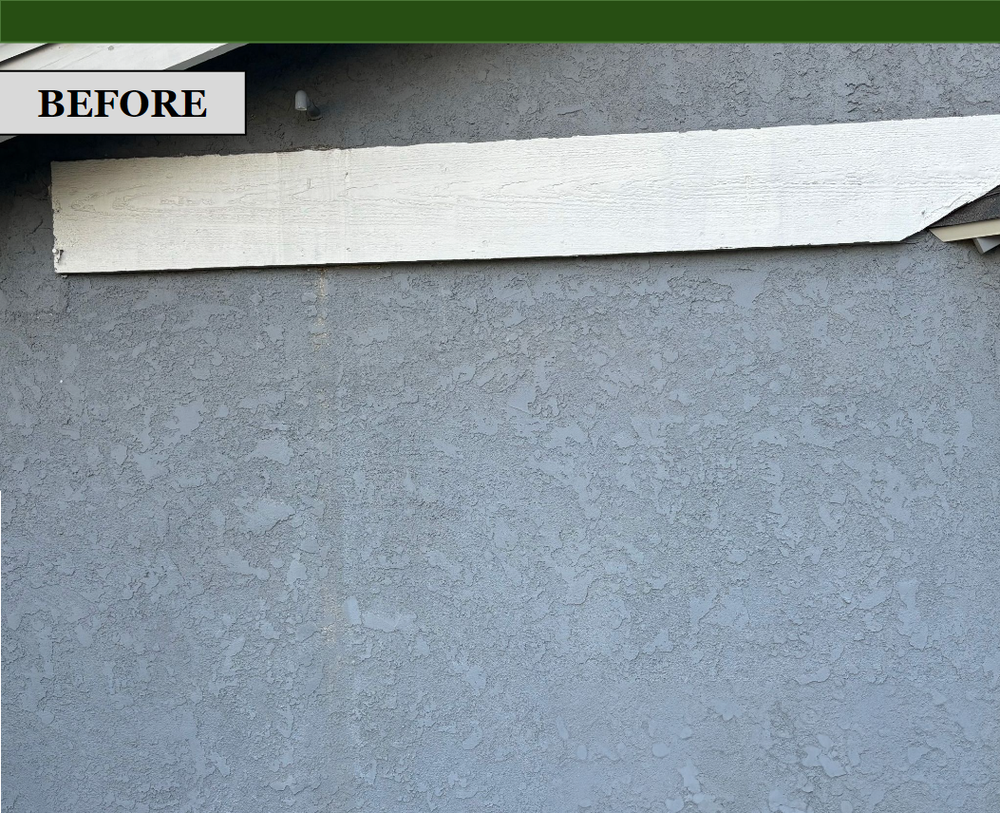 Exterior wall before insulation: stucco and wood trim